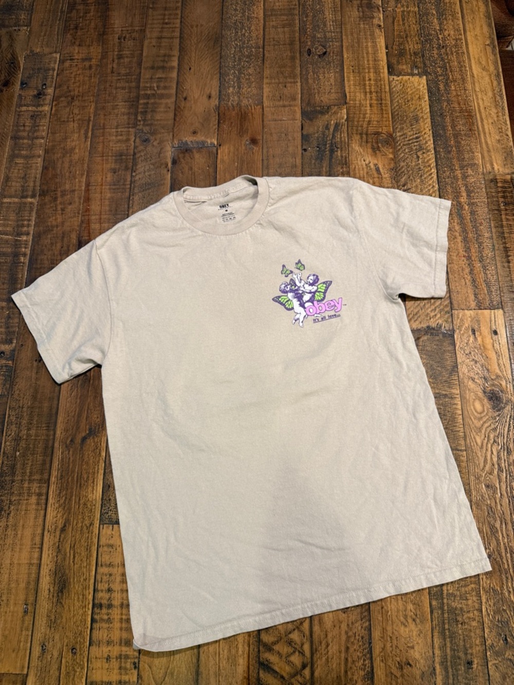 Obey Men’s Cream Short-Sleeve Graphic Tee with Purple & Green Logo